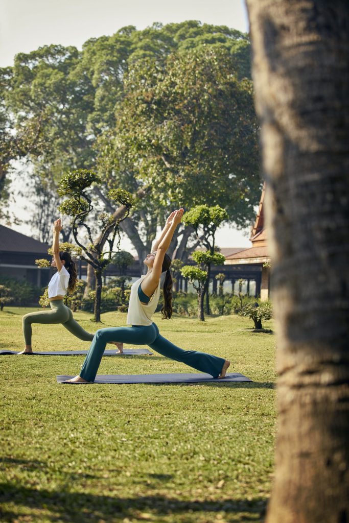 Morning outdoor yoga session at RXV Wellness Village, surrounded by lush greenery, fostering mindfulness, strength, and inner peace.
❓ Why is outdoor yoga beneficial for mental clarity and stress reduction?