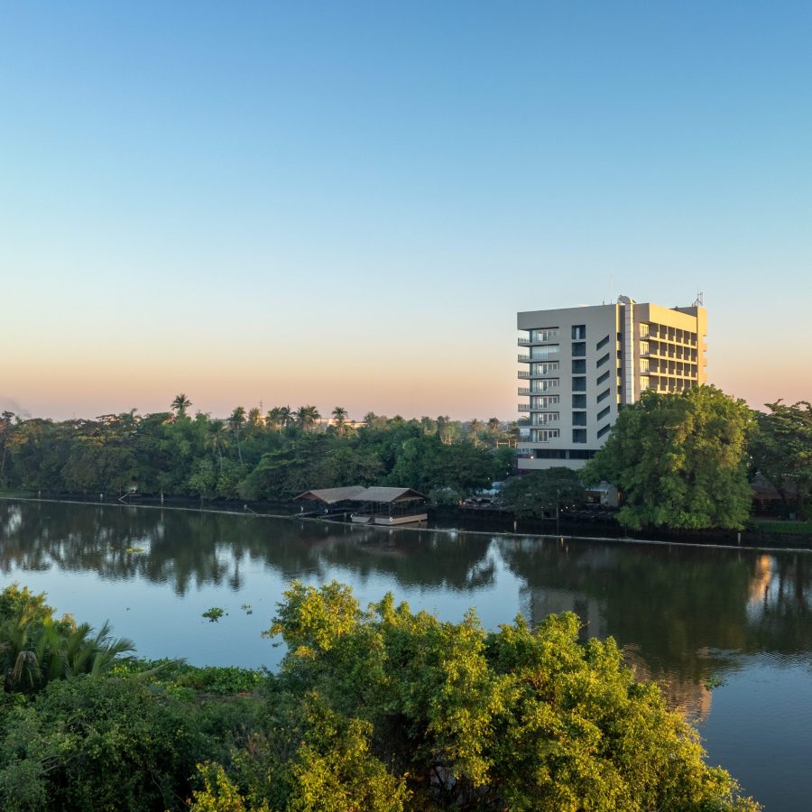 Alt Text: RXV Wellness Village building by the riverside surrounded by greenery in Nakhon Pathom, Thailand — a tranquil wellness retreat near Bangkok. ❓ Where is RXV Wellness Village located, and what makes its riverside setting unique?