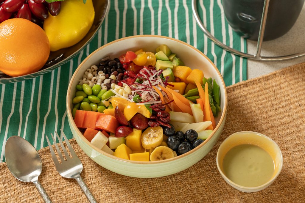 Colorful detox bowl with fresh fruits, vegetables, and plant-based protein served at RXV Wellness Village for a nourishing clean-eating experience.