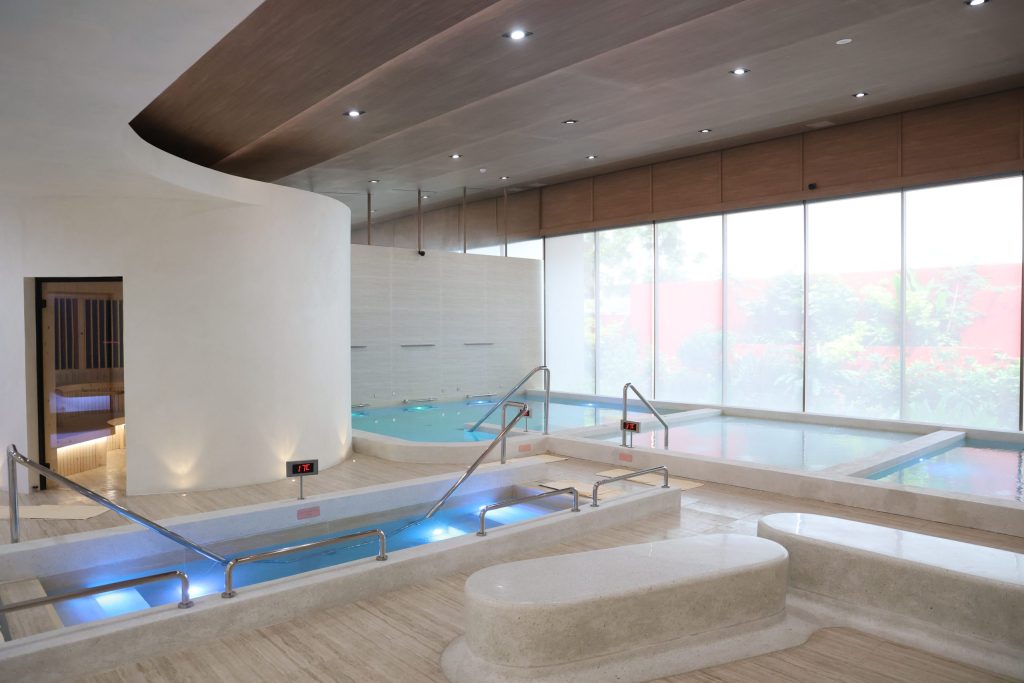 Hydrotherapy pool area at RXV Wellness Village featuring vitality pools, hot and cold plunge, and aquatic therapy zone designed for relaxation and muscle recovery.