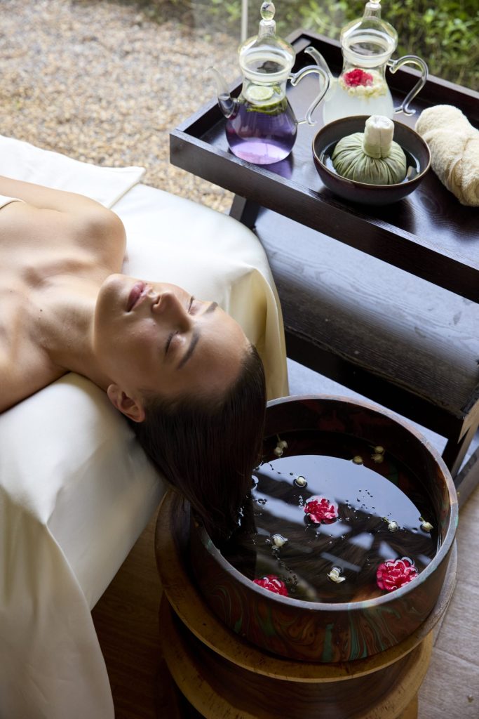 Guest enjoying a holistic spa treatment with herbal compress and aromatic foot soak at RXV Wellness Village, designed for deep relaxation and wellness restoration.
❓ What are the benefits of herbal spa treatments for stress relief and circulation?