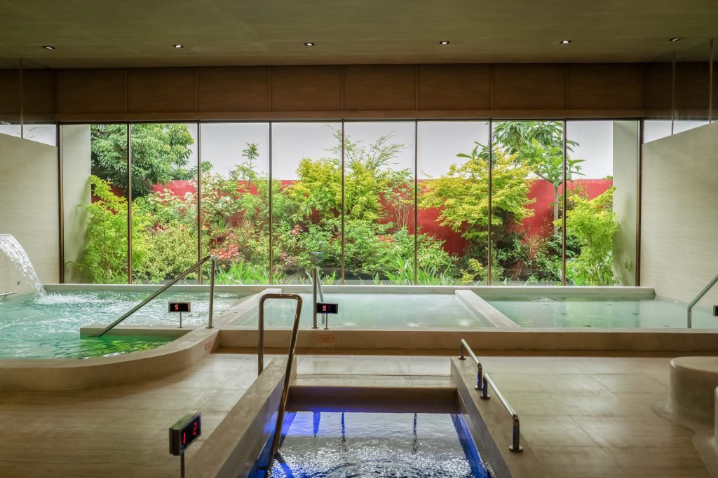 Hydrotherapy pools at RXV Wellness Village — a serene water therapy space designed to soothe muscles and improve circulation, surrounded by lush greenery.
❓ How does hydrotherapy at RXV Wellness Village support relaxation and recovery?