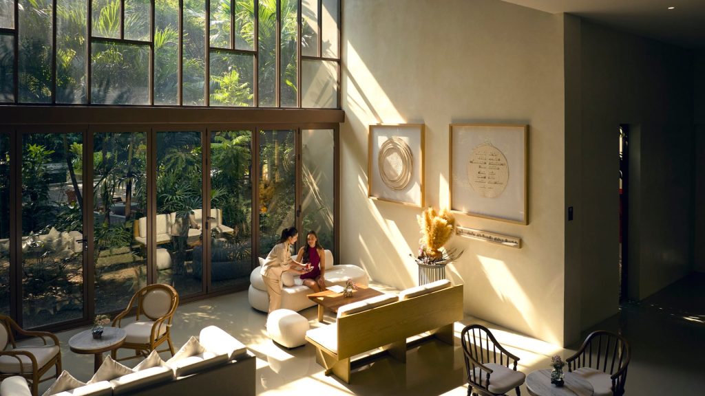 RXV Wellness Village reception lounge bathed in natural light, offering warm hospitality and personalised service.
❓ What makes RXV Wellness Village’s reception lounge a serene space for wellness guests?