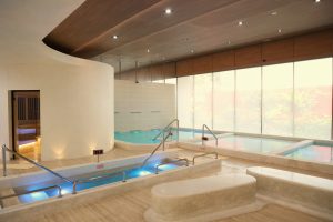 Hydrothermal therapy area with vitality pools and sauna at RXV Wellness Village Sampran.