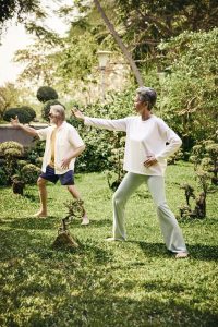 Tai Chi practice in the garden at RXV Wellness Village Sampran for balance, flexibility, and mindfulness.