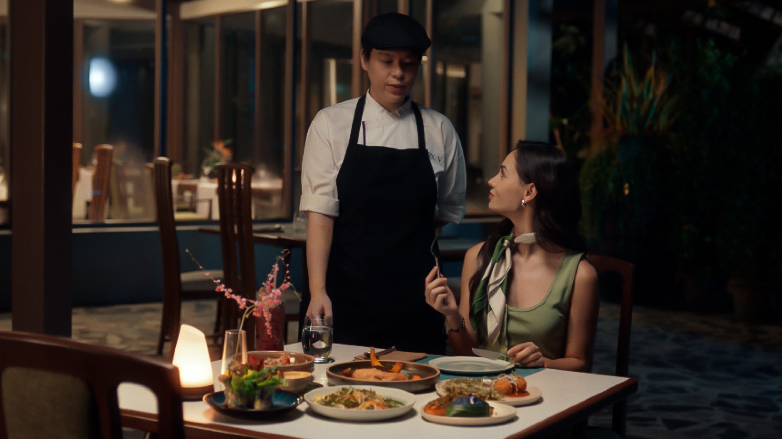 Chef serving a guest healthy dinner at RXV Wellness Village Sampran.